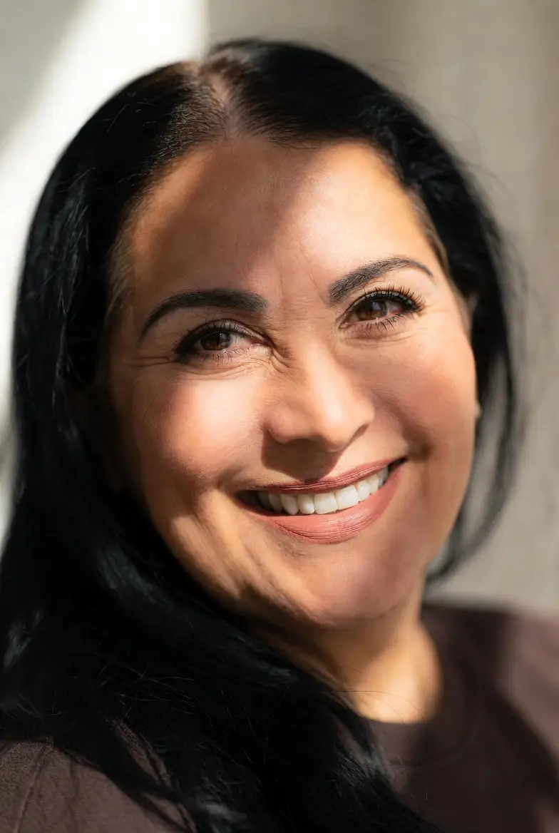 Profile photo of Elena M., a warm Latina woman in her 40s